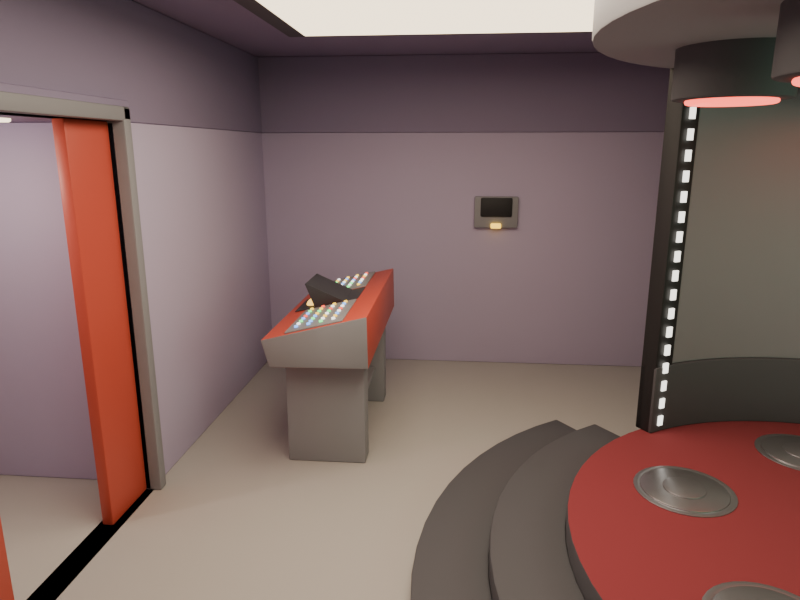 Transporter room control console, wall intercom and the doors out to the corridor